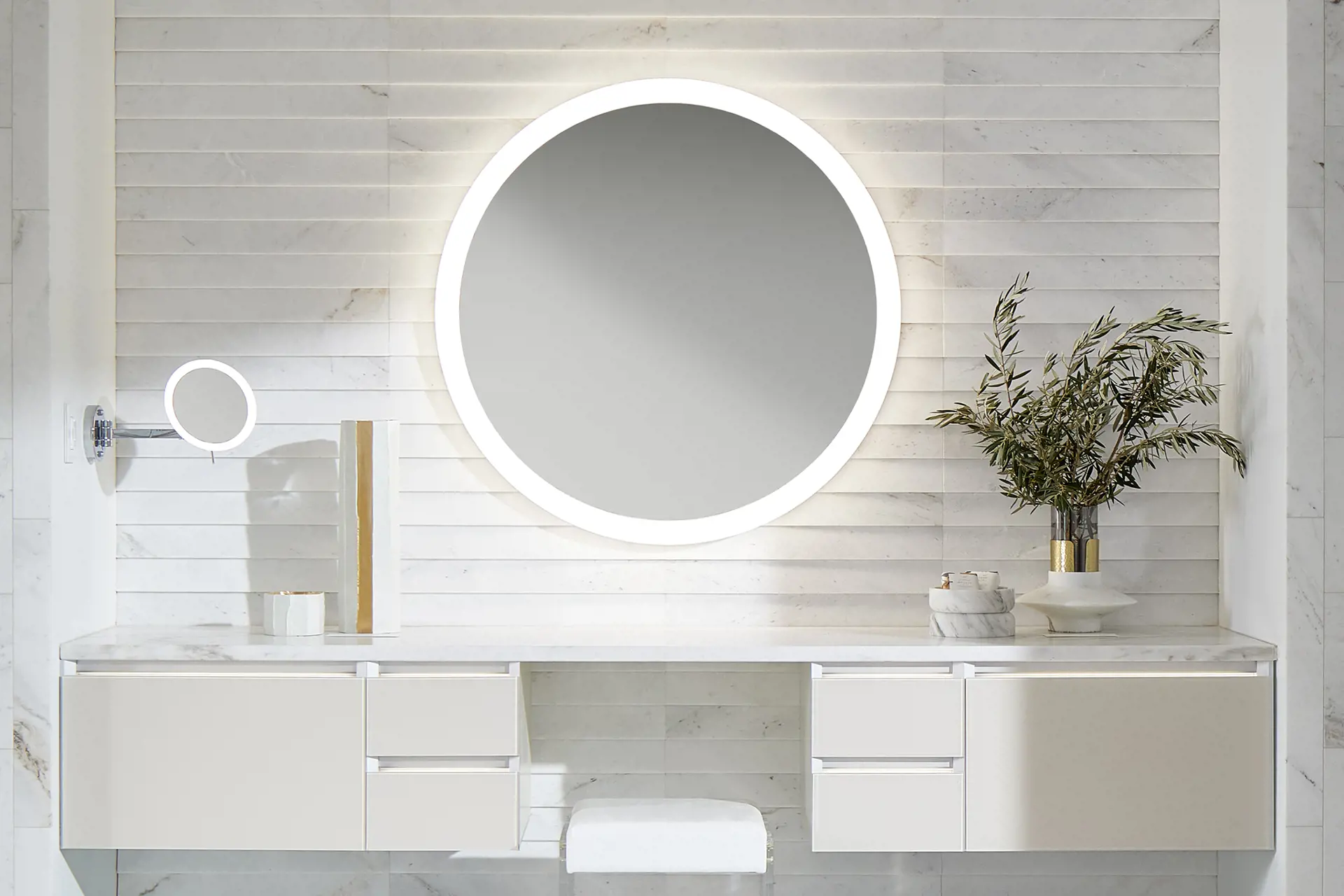 stunning white bathroom with round bathroom mirror and white modular vanity